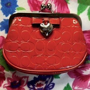 Vintage COACH coin purse.  Fabulous Vintage Orange With Bow And Heart Hardware